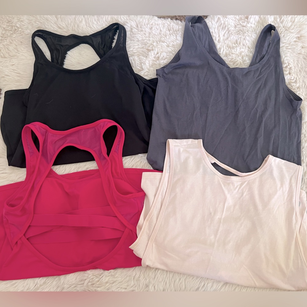 LOT of Fabletics Workout Tanks.